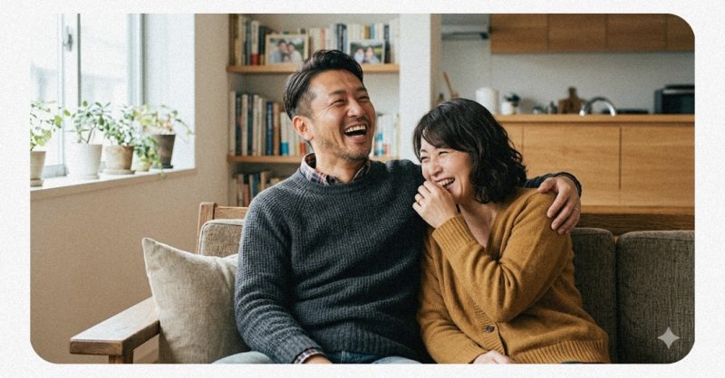 楽しそうに大笑いしている夫婦のイメージ